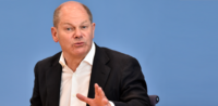 Symbolbild: Olaf Scholz © shutterstock, bearbeitet by iQ